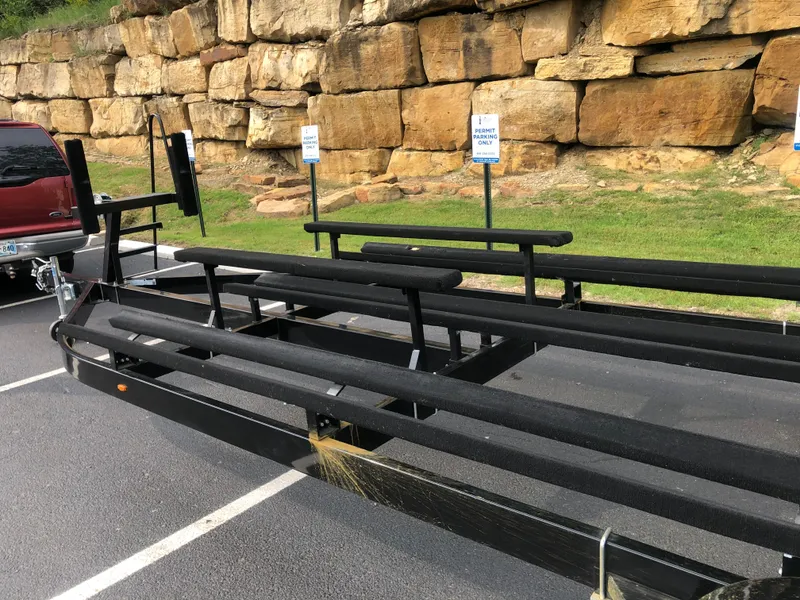 Slide: The Image of Trailer for 2022 Tahoe Pontoon GT 2585 RF parked near rocky wall. - 20