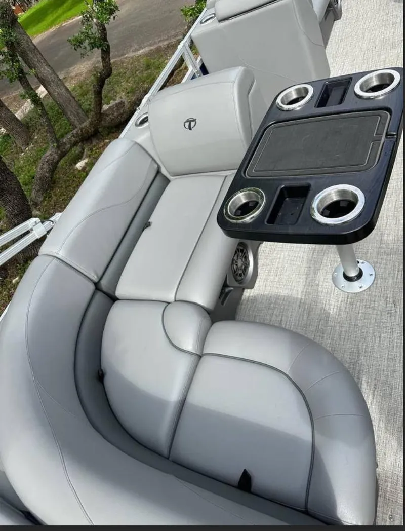 Slide: The Image of 2022 Tahoe Pontoon GT 2585 RF with gray seating and cupholder table. - 3