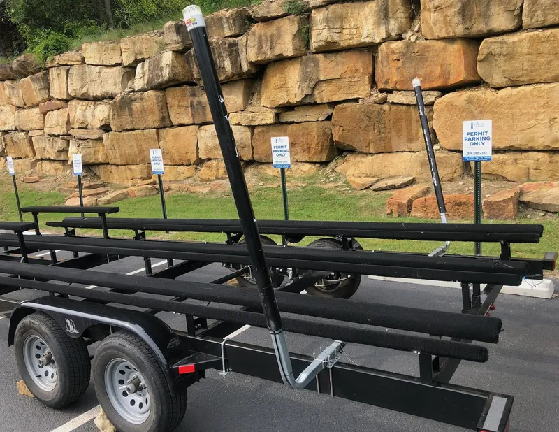 Slide: The Image of Trailer for 2022 Tahoe Pontoon GT 2585 RF parked near rocky wall. - 5