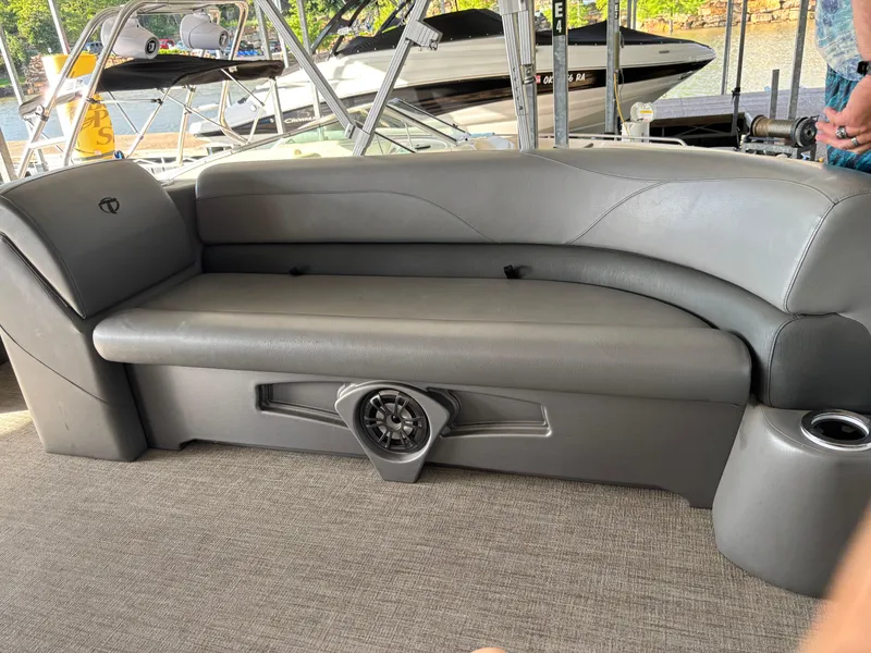 Slide: The Image of 2022 Tahoe Pontoon GT 2585 RF interior with gray seating and speaker system. - 7