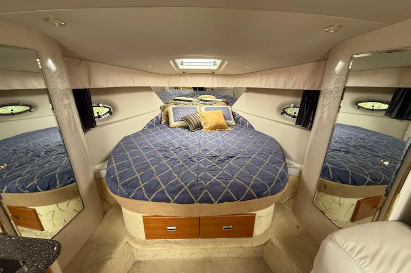 Slide: The Image of Luxurious cabin interior of a 2003 Formula 37 PC yacht with a cozy bed. - 15