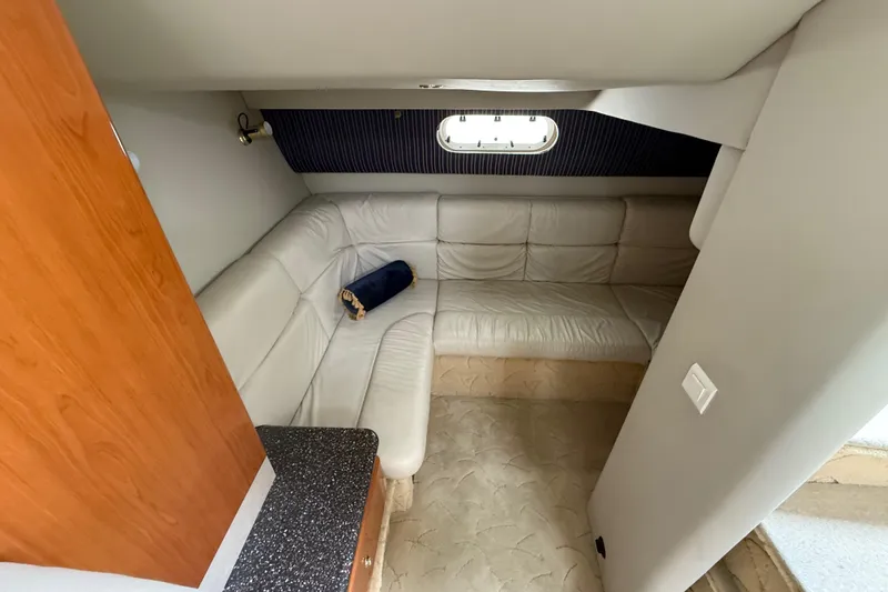 Slide: The Image of Interior of 2003 Formula 37 PC yacht with white leather seating and wooden cabinetry. - 18