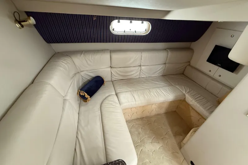 Slide: The Image of Luxurious interior of a 2003 Formula 37 PC yacht with white leather seating. - 19