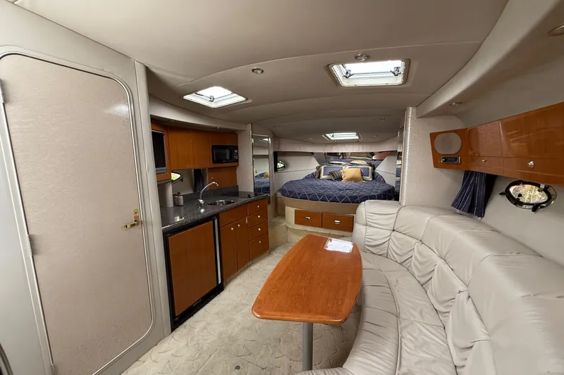 Slide: The Image of Luxurious interior of a 2003 Formula 37 PC yacht with kitchen and cozy seating area. - 20