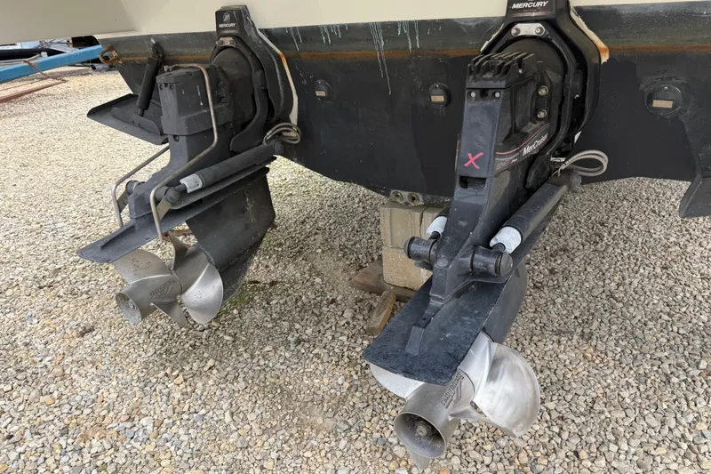 Slide: The Image of 2003 Formula 37 PC boat with dual Mercury outdrives on gravel surface. - 23