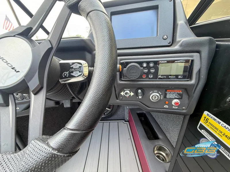 Slide: The Image of 2019 Moomba Craz dashboard with steering wheel, control panel, and cruise control lever. - 26