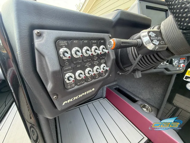Slide: The Image of Control panel of a 2019 Moomba Craz boat with various switches and labels. - 27