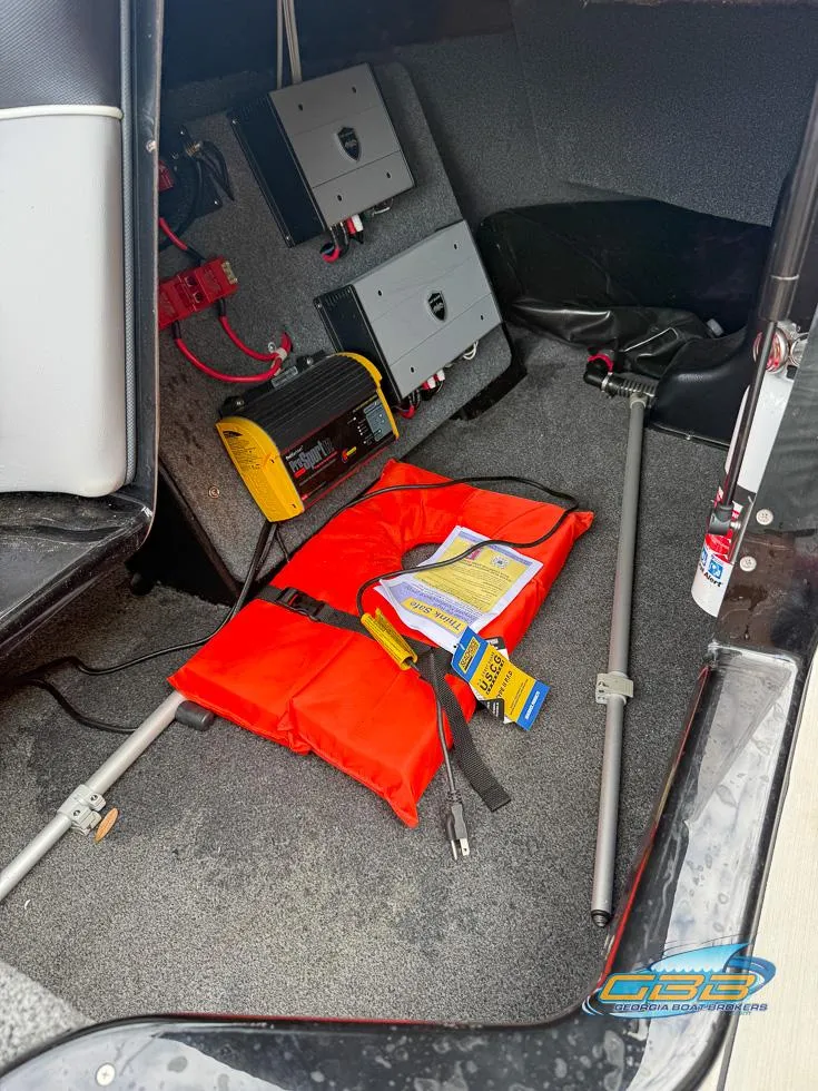 Slide: The Image of 2019 Moomba Craz boat storage with life jacket, battery charger, and equipment. - 29