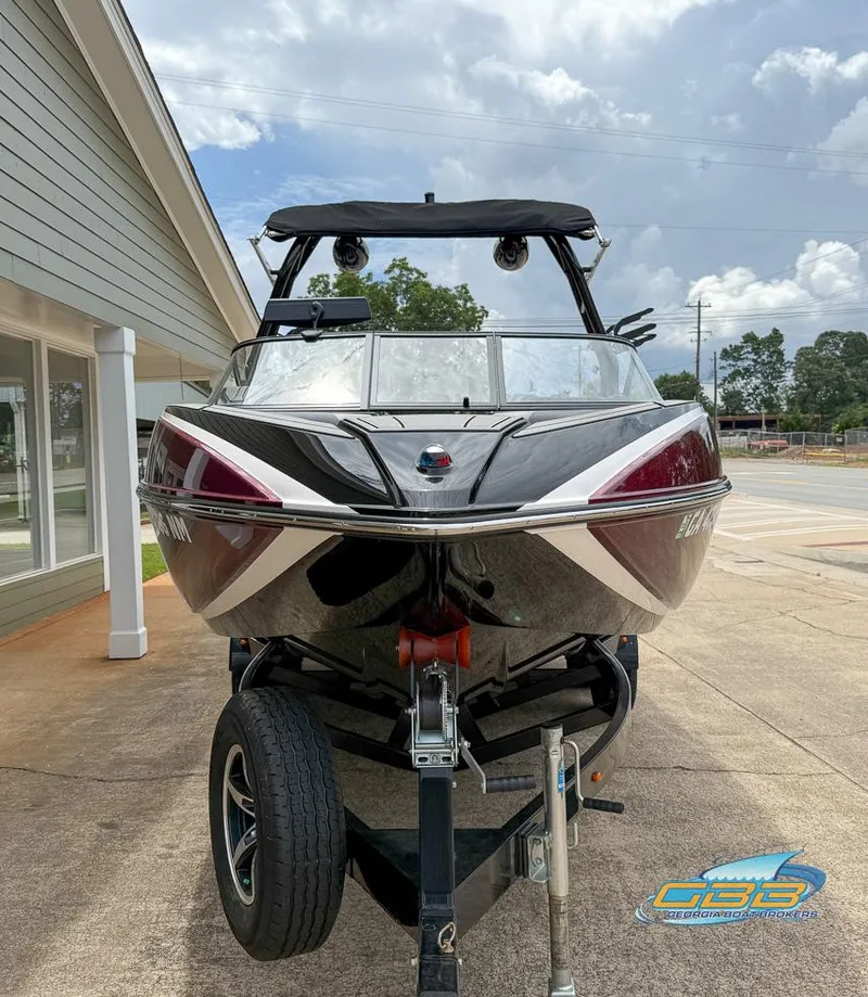 Slide: The Image of 2019 Moomba Craz boat on trailer, parked outdoors under cloudy sky. - 3