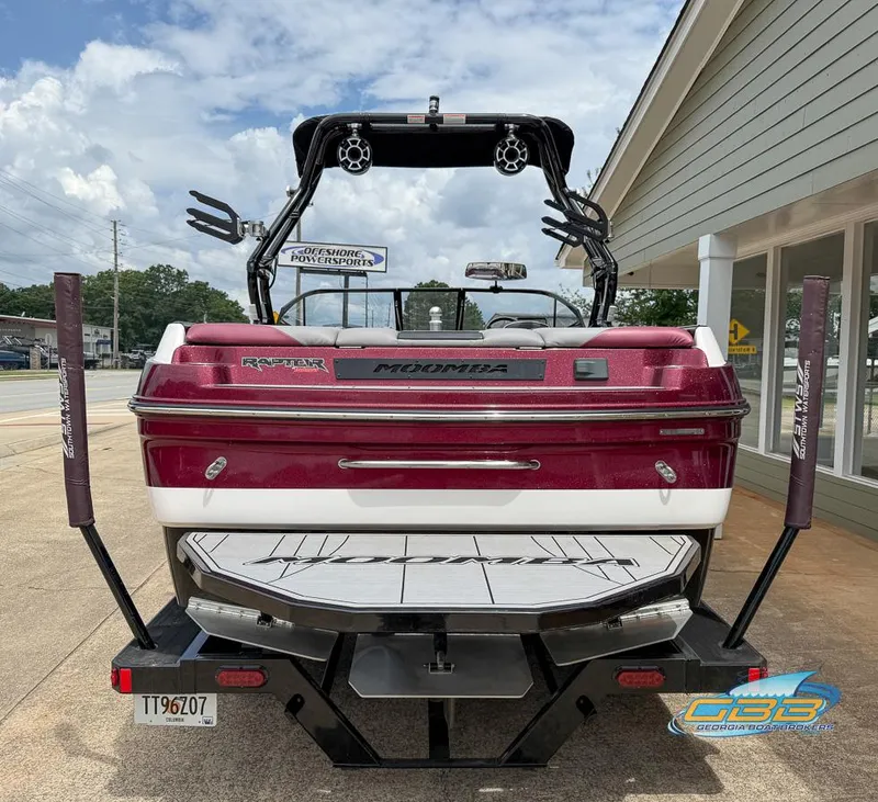 Slide: The Image of 2019 Moomba Craz boat, rear view, parked outdoors with wakeboard tower. - 4