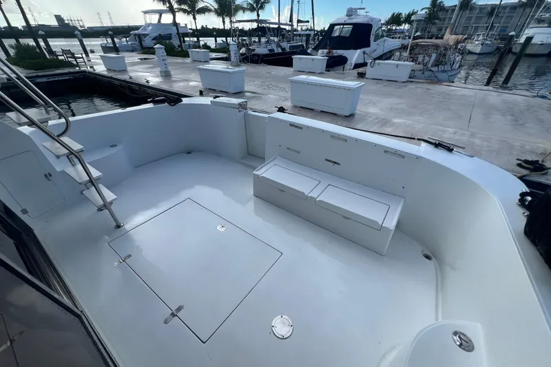 Slide: The Image of 2001 Jefferson International 5300 yacht deck with seating, docked at marina. - 10
