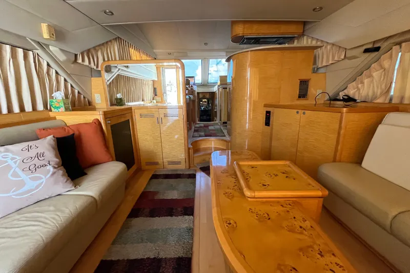 Slide: The Image of Luxurious interior of a 2001 Jefferson International 5300 yacht with elegant wood finishes. - 12