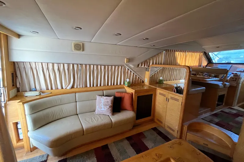 Slide: The Image of Luxurious interior of a 2001 Jefferson International 5300 yacht with elegant seating and wood finishes. - 13
