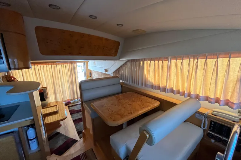 Slide: The Image of Luxurious interior of a 2001 Jefferson International 5300 yacht with elegant dining area. - 18