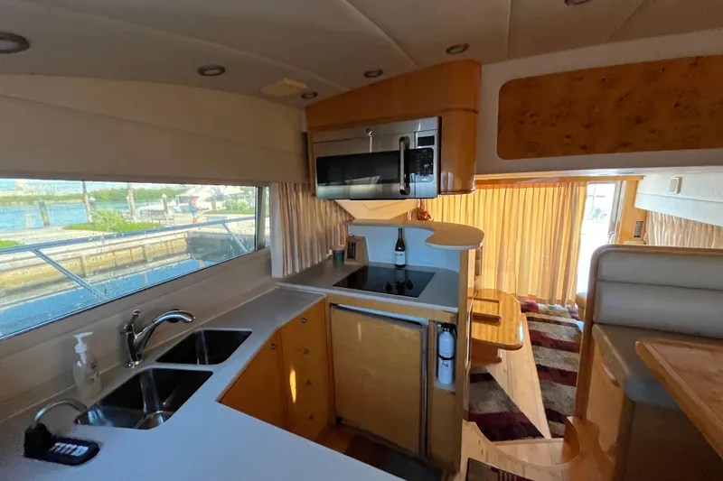 Slide: The Image of Luxurious kitchen interior of a 2001 Jefferson International 5300 yacht with modern amenities. - 19