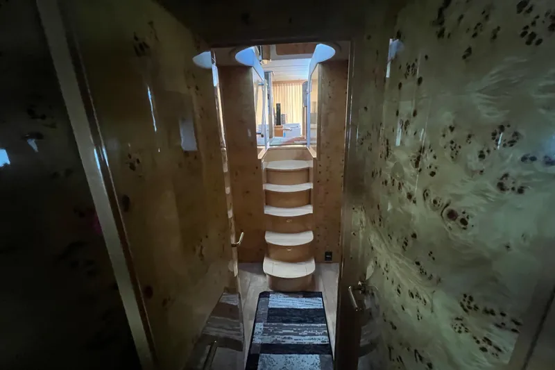 Slide: The Image of Interior of 2001 Jefferson International 5300 yacht with wooden staircase and luxurious design. - 21