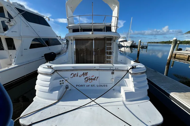 Slide: The Image of 2001 Jefferson International 5300 yacht docked, featuring "It's All Good!" text, Port of St. Louis. - 3