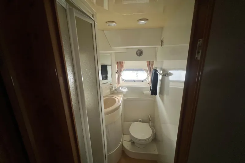 Slide: The Image of Compact bathroom in a 2001 Jefferson International 5300, featuring a shower, sink, and toilet. - 30