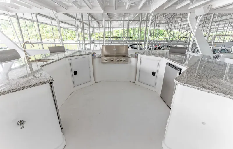 Slide: The Image of Outdoor kitchen on 1997 Sumerset 18 x 93 houseboat with granite countertops and stainless steel grill. - 17