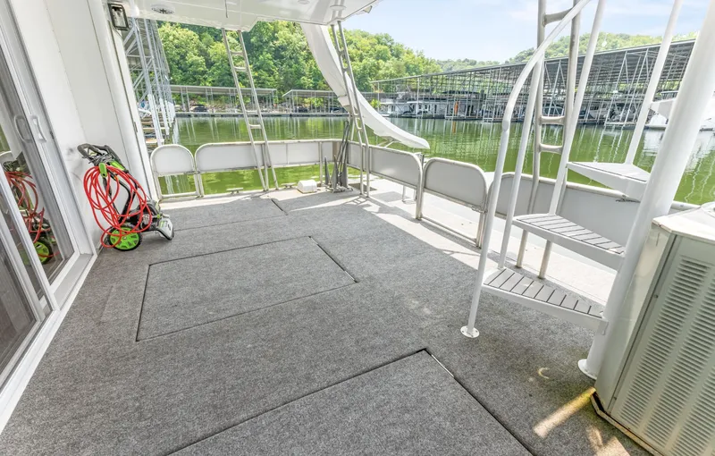 Slide: The Image of Outdoor deck of a 1997 Sumerset 18 x 93 houseboat with slide and marina view. - 26