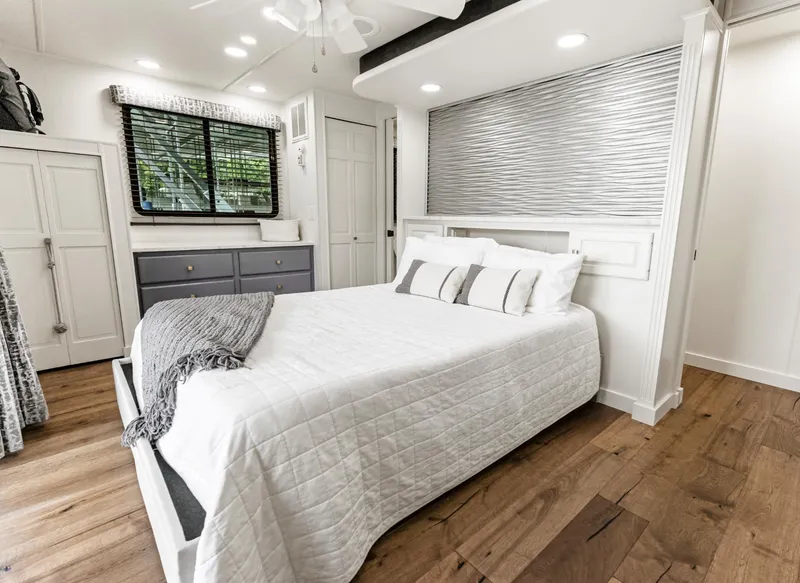 Slide: The Image of Luxurious bedroom interior in a 1997 Sumerset 18 x 93 houseboat, featuring modern decor. - 33