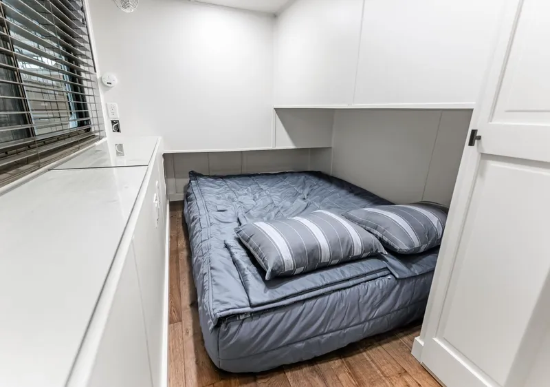 Slide: The Image of Cozy bedroom with blue bedding in a 1997 Sumerset 18 x 93 houseboat. - 40