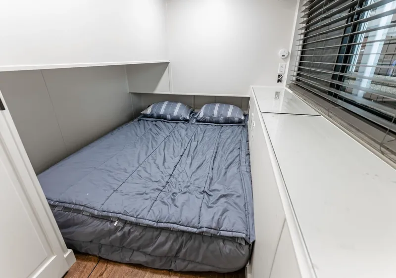 Slide: The Image of Cozy bedroom with a double bed in a 1997 Sumerset 18 x 93 houseboat. - 44