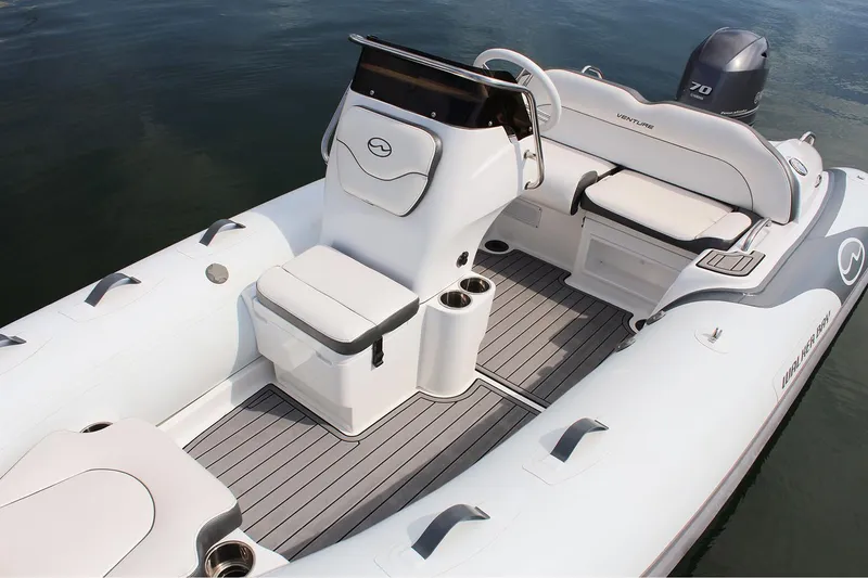 Slide: The Image of Manufacturer Provided Image: 2022 Walker Bay Venture 14 boat interior with seating and steering console. - 1