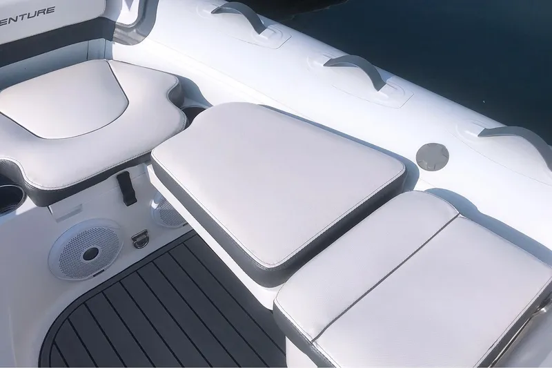 Slide: The Image of Manufacturer Provided Image: 2022 Walker Bay Venture 14 boat interior seating and deck. - 2