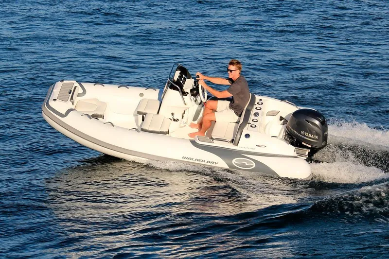 Slide: The Image of Manufacturer Provided Image: 2022 Walker Bay Venture 14 boat cruising on water. - 26