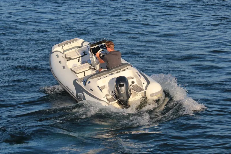 Slide: The Image of Manufacturer Provided Image: 2022 Walker Bay Venture 14 boat cruising on water. - 27