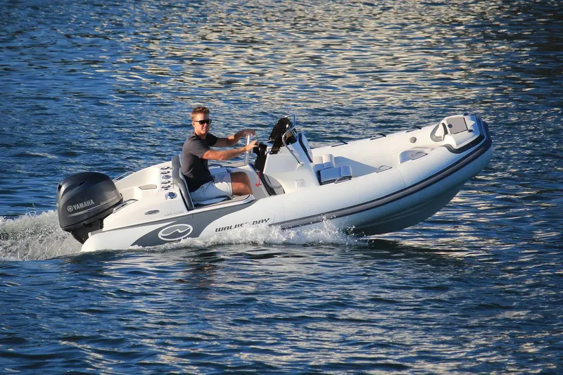 Slide: The Image of Manufacturer Provided Image: 2022 Walker Bay Venture 14 boat cruising on water. - 29