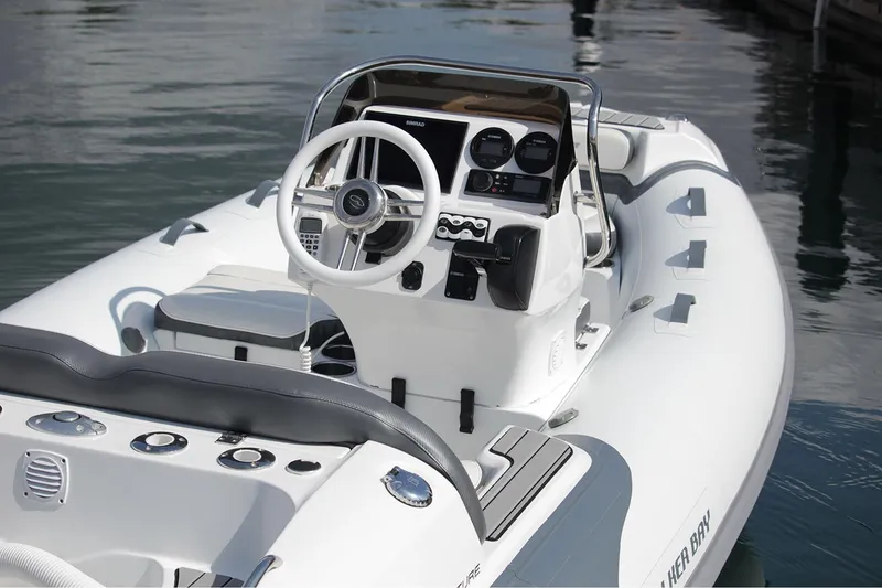 Slide: The Image of Manufacturer Provided Image: 2022 Walker Bay Venture 14 boat interior with steering wheel and control panel. - 4