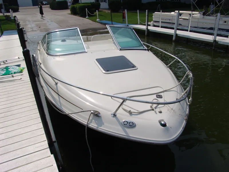 Slide: The Image of 2000 Sea Ray 215 Express Cruiser docked at marina. - 2