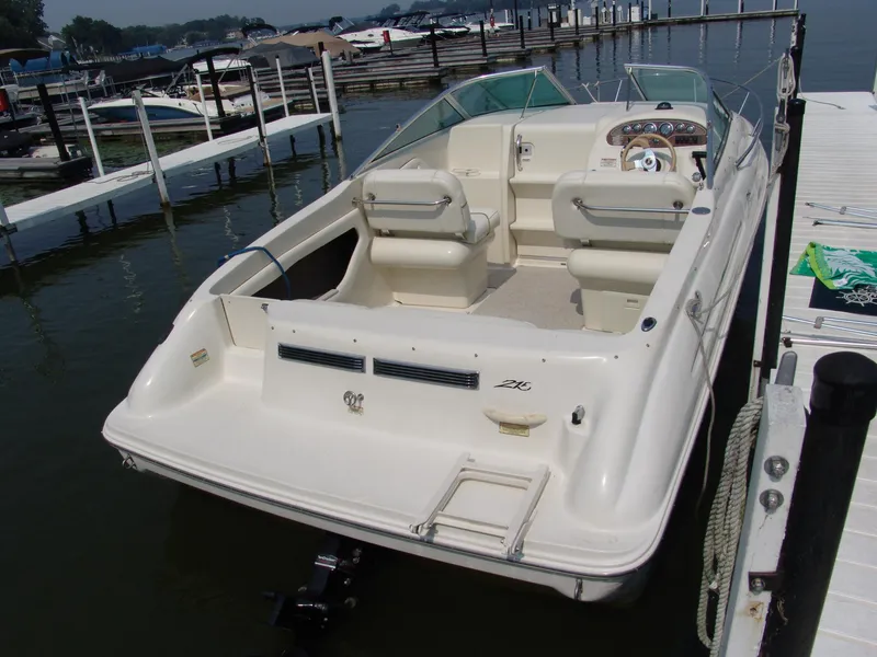 Slide: The Image of 2000 Sea Ray 215 Express Cruiser docked at marina, rear view. - 3