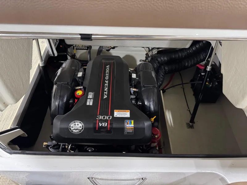 Slide: The Image of 2015 Cobalt 24 SD boat engine compartment with Volvo Penta 300 V8 engine. - 14