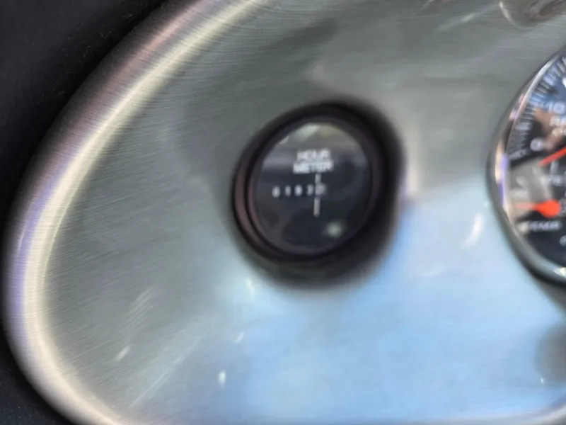 Slide: The Image of Close-up of a 2007 Centurion Air Warrior Elite V-Drive C4 hour meter and gauge. - 13