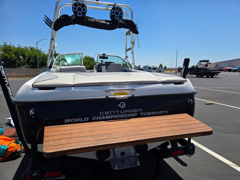 Slide: The Image of 2007 Centurion Air Warrior Elite V-Drive C4 boat in parking lot, rear view. - 5