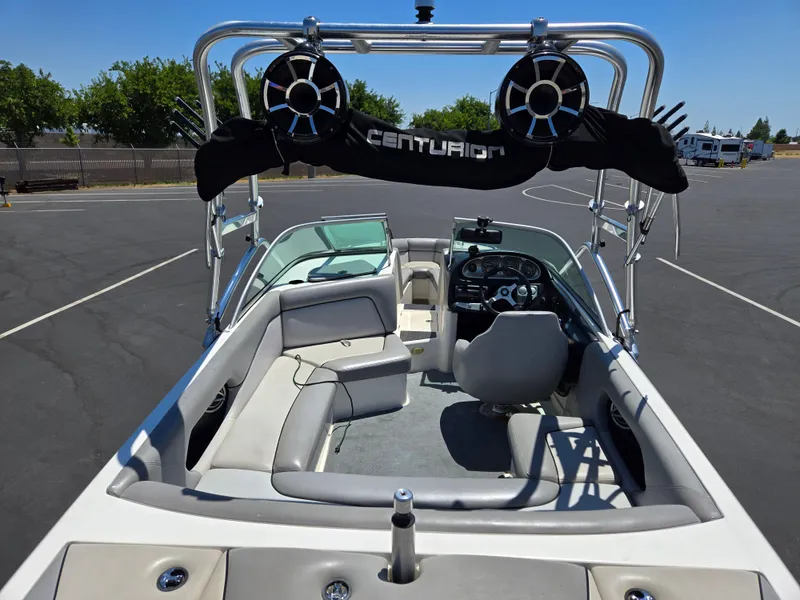 Slide: The Image of 2007 Centurion Air Warrior Elite V-Drive C4 boat interior with seating and steering wheel. - 6