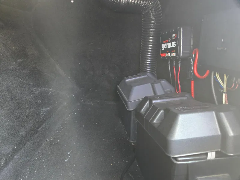 Slide: The Image of 2007 Centurion Air Warrior Elite V-Drive C4 battery compartment with wiring and charger. - 8