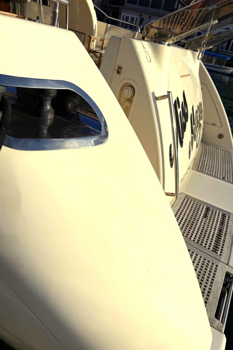 Slide: The Image of 1996 Azimut 54 yacht deck with sleek design and elegant detailing. - 10