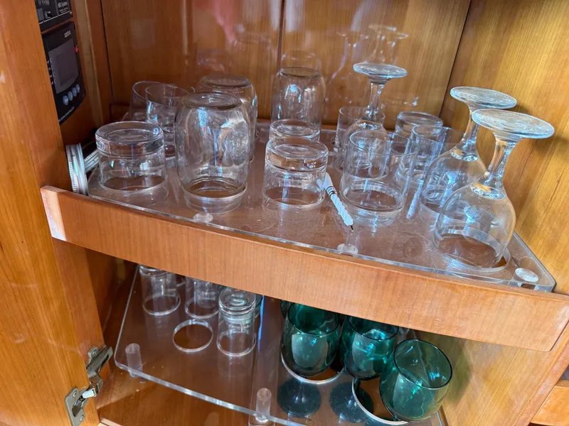 Slide: The Image of Glassware storage in wooden cabinet on 1996 Azimut 54 yacht. - 21