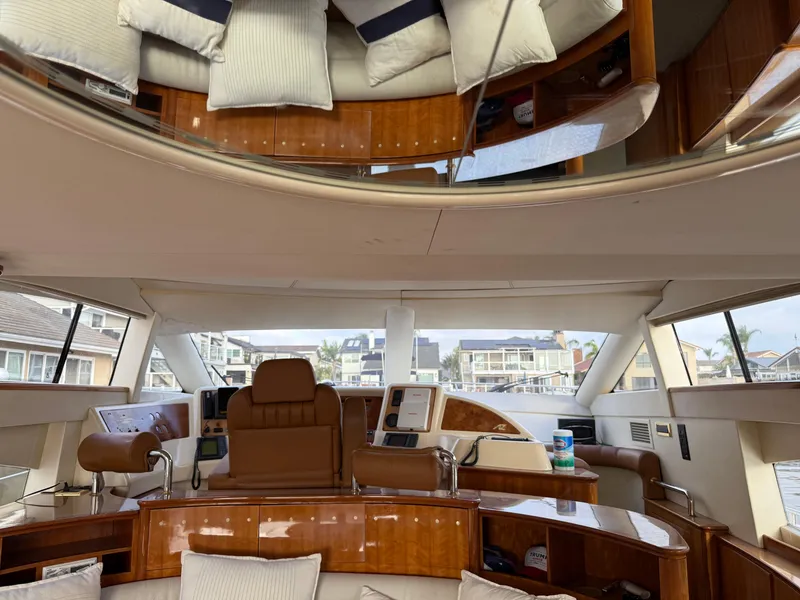 Slide: The Image of Luxurious interior of a 1996 Azimut 54 yacht with plush seating and modern controls. - 24