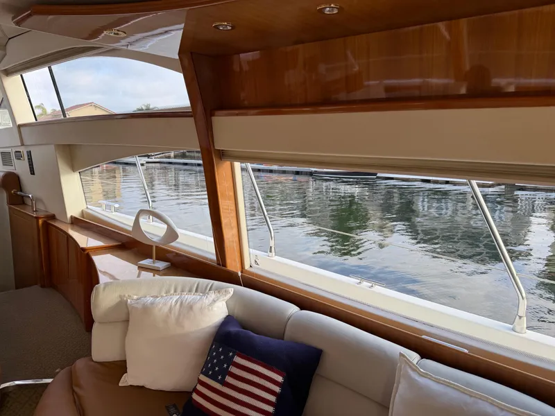 Slide: The Image of Interior view of 1996 Azimut 54 yacht with comfortable seating and large windows. - 25