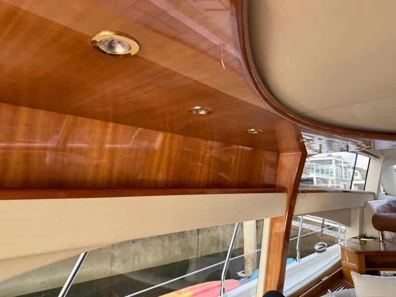 Slide: The Image of Interior of a 1996 Azimut 54 yacht with polished wood finish and recessed lighting. - 27