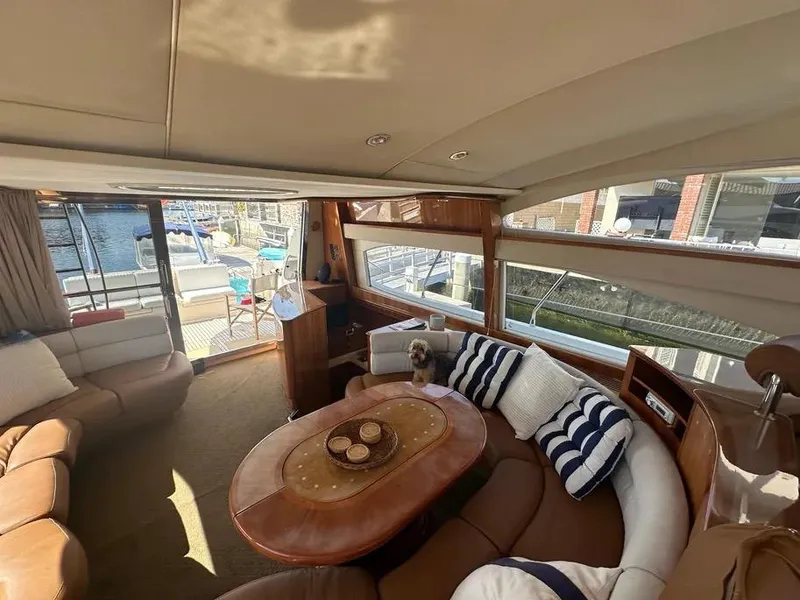 Slide: The Image of Interior of a 1996 Azimut 54 yacht with cozy seating and nautical decor. - 35
