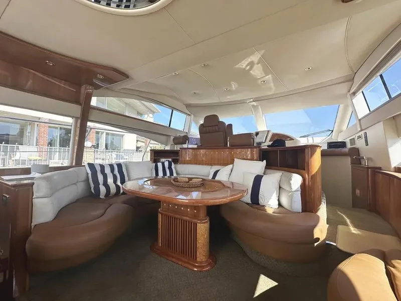 Slide: The Image of Luxurious interior of a 1996 Azimut 54 yacht with elegant seating and wooden accents. - 38