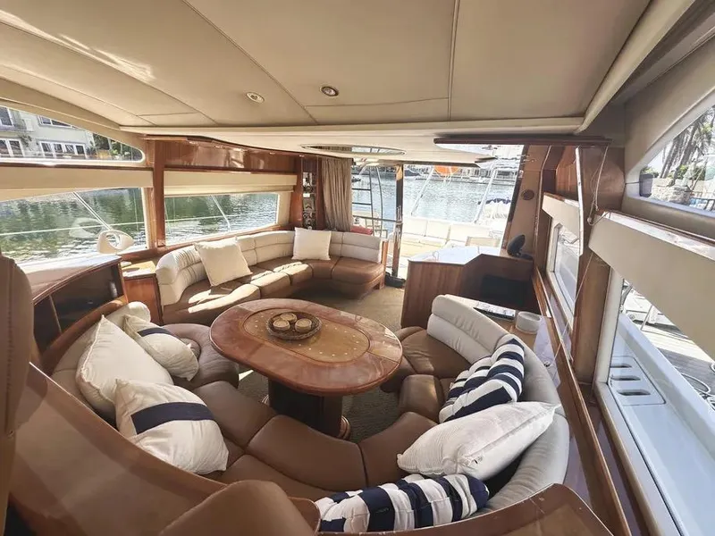 Slide: The Image of Luxurious interior of a 1996 Azimut 54 yacht with elegant seating and panoramic windows. - 39