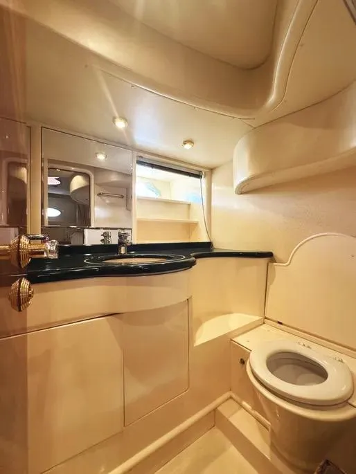 Slide: The Image of Luxurious bathroom in a 1996 Azimut 54 yacht, featuring elegant fixtures and lighting. - 46
