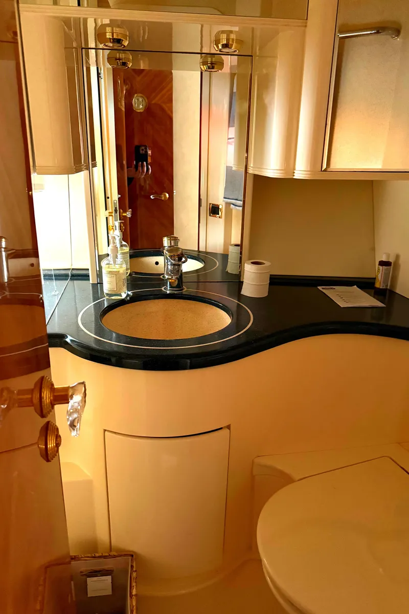 Slide: The Image of Luxurious bathroom interior of a 1996 Azimut 54 yacht, featuring elegant fixtures and a sleek design. - 48